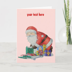 santa wrapping gifts and toys for christmas holiday card