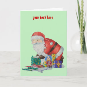 santa wrapping gifts and toys for Christmas Holiday Card
