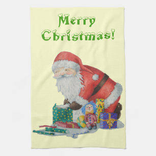 santa wrapping pressies original christmas tea towel