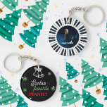 Santa's Favourite Pianist Photo Piano Key Black Key Ring<br><div class="desc">Grand piano keys Christmas keychain for a piano player, pianist, student, teacher, musician, instructor, kids, friends, etc. Front part: A cute jingle bell outline image and snowflakes with an elegant script typography of "Santa's favourite pianist" in white, green and red colour, on a black backdrop. Back part: A piano circle...</div>