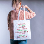 Santa's Humour Haven Tote<br><div class="desc">Embrace the festive season with our "Dear Santa" Tote Bag. Express your holiday humour with a witty message, declaring your wishes for a fat bank account and a skinny body. Let Santa know not to mix it up this year! This cute tote is perfect for carrying your essentials while spreading...</div>