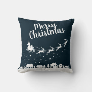 Santa's sleigh & reindeers flying above the city cushion