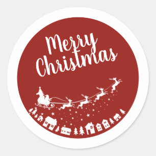 Santa's sleigh silhouette flying above the houses classic round sticker