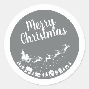 Santa's sleigh silhouette flying above the houses classic round sticker
