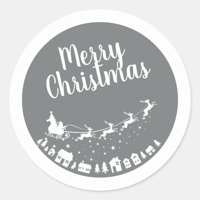 Santa's sleigh silhouette flying above the houses classic round sticker (Front)