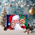 Santa's Yorkies at Christmas Holiday Card<br><div class="desc">Santa has a sweet spot for Yorkies and hugs his two Yorkshire Terriers by the Christmas Tree. Santa knows his furry friends will be there to welcome him home when all the treats and presents have been delivered Christmas Eve.</div>