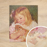 Sara Holding a Cat | Mary Cassatt Jigsaw Puzzle<br><div class="desc">Sara Holding a Cat (1908) by American impressionist artist Mary Cassatt. Original fine art painting depicts a portrait of a little girl wearing a pink dress and holding a kitten. 

Use the design tools to add custom text or personalise the image.</div>