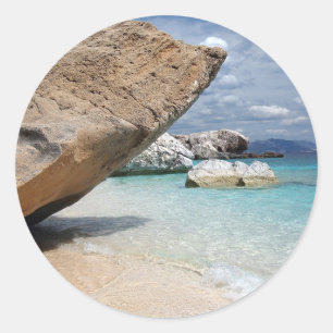 Sardinia beach with big rocks round sticker