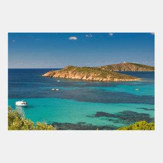 Sardinian blue sea and sky with boats and cliff
