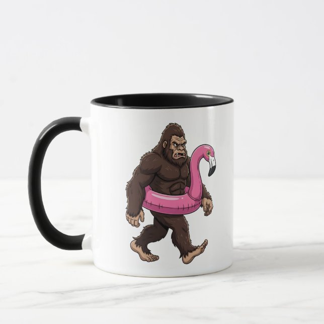 Sasquatch in a Flamingo Float Funny Cryptid Summer Mug (Left)