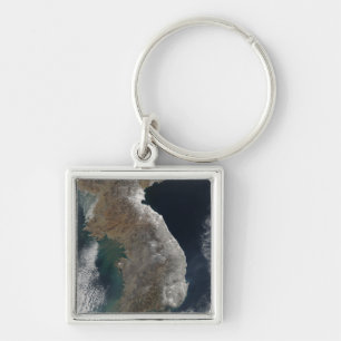 Satellite view of snowfall key ring