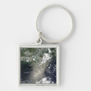 Satellite view of streaks and ribbons of oil key ring