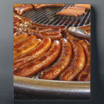 Sausages Plaque<br><div class="desc">German sausages sizzling on the grill ready to be served. Hot,  tasty and delicious.</div>