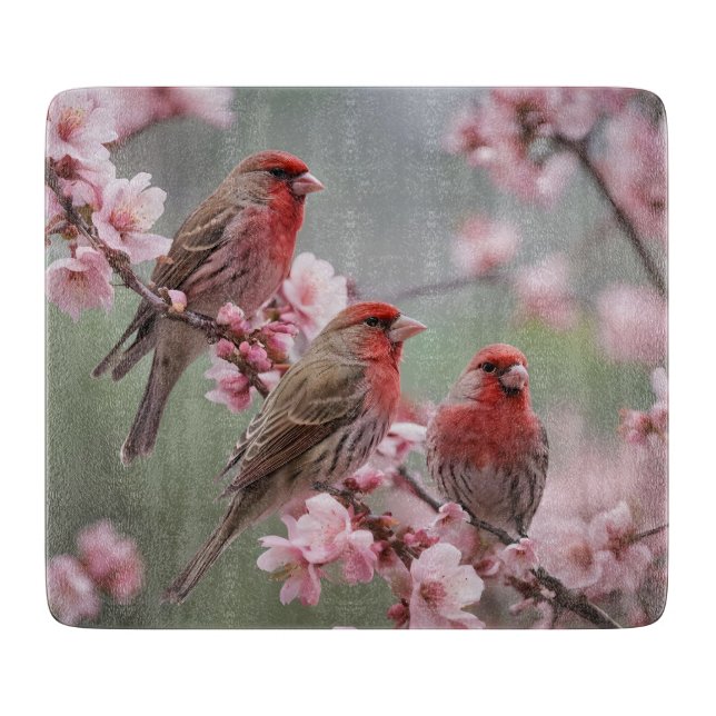 "Scarlet Trio: Red Finches Among Pink Blossoms" Cutting Board (Front)