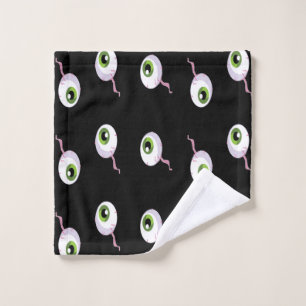 Scary eyeballs on black wash cloth