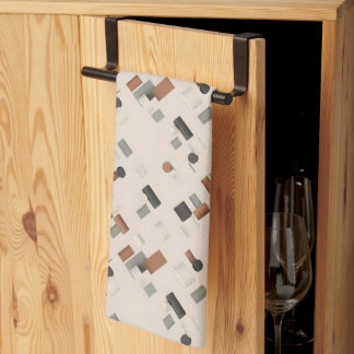 Scattered coloured 3D geometric blocks on a light Tea Towel