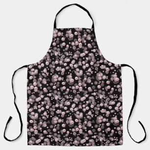 Scatterings of pink and white pearls on black velv apron