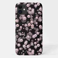 Scatterings of pink and white pearls on black velv