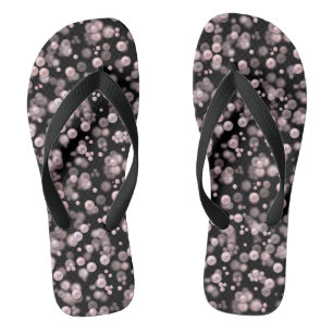 Scatterings of pink and white pearls on black velv flip flops