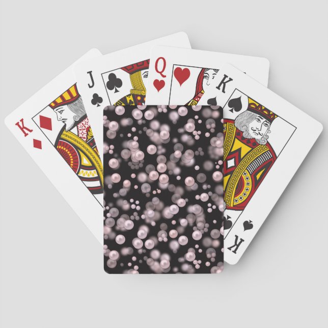 Scatterings of pink and white pearls on black velv playing cards (Back)