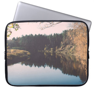 Scenic autumn coloured river in country with trees laptop sleeve