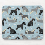 Schnauzer Paws and Bones Mouse Mat<br><div class="desc">Cute Schnauzer dogs in black,  salt and pepper and black and silver coats sit,  stand and rollover with scattered dog bones and paw prints on a light blue background.</div>