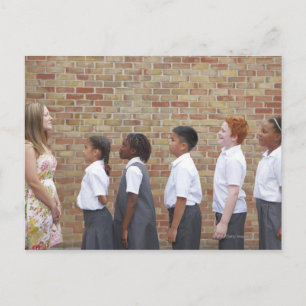 School children lining up in the playground for postcard
