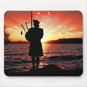 Scotland bag pipper at sunset mouse mat