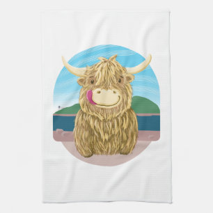 Scottish Highland Cow, Chilling On The Beach Tea Towel