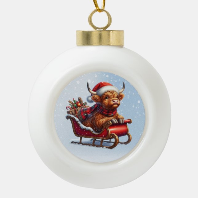 Scottish highland Santa cow in sled Ceramic Ball Christmas Ornament (Front)