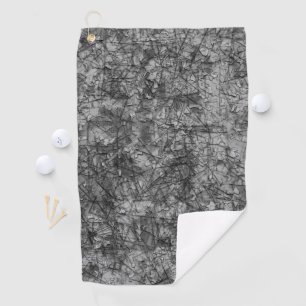 Scratches on a lightly spotted grey to black golf towel