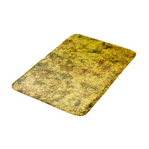 Scratches on a lightly spotted ochre yellow image bath mat