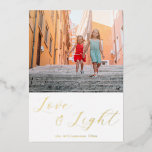 Script Love Light Simple Hanukkah Two Photo Gold Foil Holiday Card<br><div class="desc">Send warm Hanukkah wishes with this elegant "Love and Light" card, featuring your photo framed by beautiful script calligraphy in gold foil. The modern minimalist aesthetic adds a touch of sophistication, while the customisable text allows you to tailor the holiday greeting to your liking. Perfect for sharing the joy of...</div>