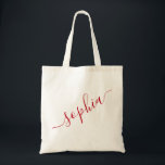 Script Name Red Personalised Modern Simple Tote Bag<br><div class="desc">Chic red personalised labelled reusable canvas tote bag with custom name text for bridesmaid gifts, bachelorette parties, birthday favours, and girls trip keepsakes, and graduation gift for cute college and dorm room storage. Perfect for sports and hobby gear storage and transport. Colours and fonts are editable, just click “customise further”...</div>
