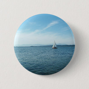 sea and sail boat under blue sky 6 cm round badge