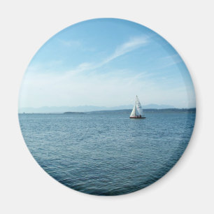 sea and sail boat under blue sky magnet