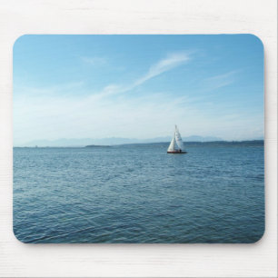 sea and sail boat under blue sky mouse mat