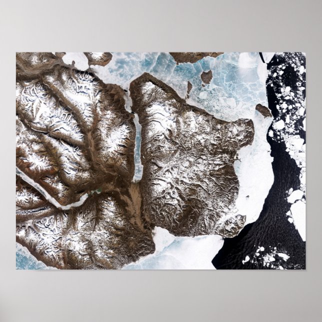 Sea ice lines the shoreline in eastern Greenlan Poster (Front)