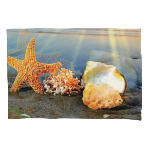 Sea shells and starfish on beach pillowcase