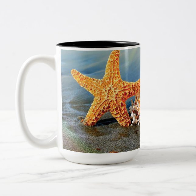 Sea shells and starfish on beach Two-Tone coffee mug (Left)
