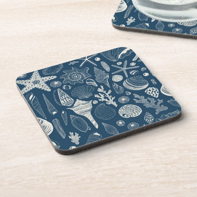 Sea shells on  dark blue coaster (Left Side)