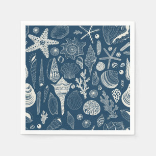 Sea shells on  dark blue napkin