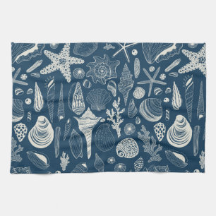 Sea shells on dark blue tea towel