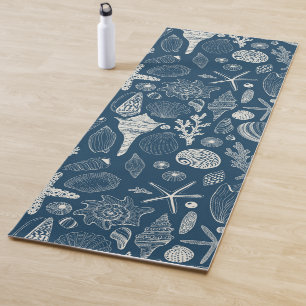 Sea shells on  dark blue yoga mat