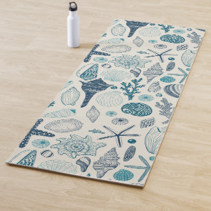 Sea shells on off white yoga mat