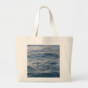 Sea water closeup large tote bag
