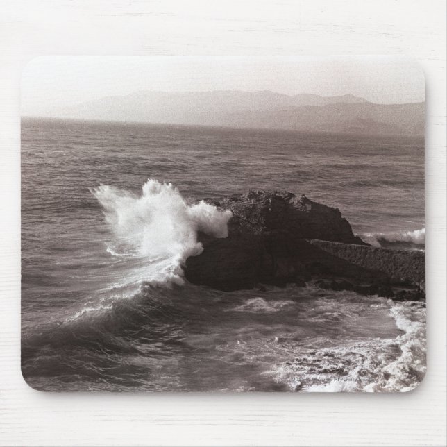 Sea waves crashing against rock mouse mat (Front)