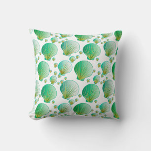 Seafoam green seashells on white cushion