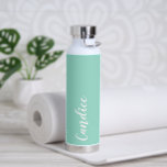 Seafoam Personalised Wedding Bridesmaid Water Bottle<br><div class="desc">Gift your wedding bridesmaid or maid or honour with this trendy, vacuum Insulated water bottle that features her name in white, stylised script on a seafoam colour background designed to match your wedding colour scheme. Personalise bottle by editing and replacing name with your own as desired. Select your water bottle...</div>