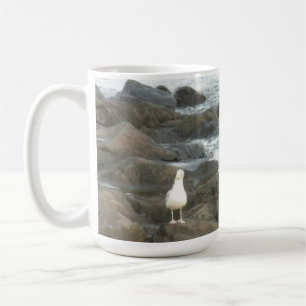 Seagull on rocks coffee mug